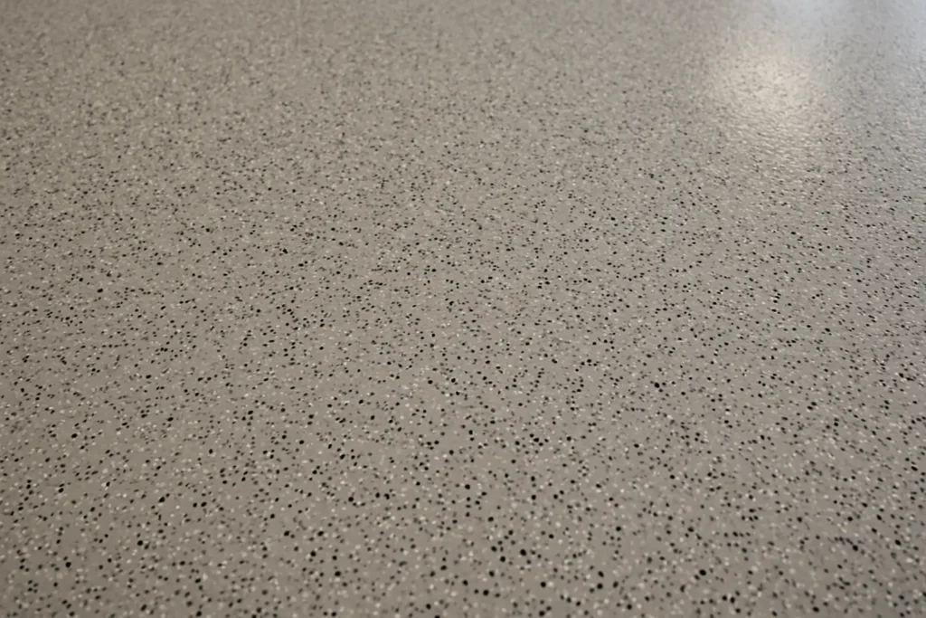 Close-up of commercial epoxy flooring with speckled finish in Orlando